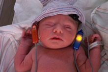 Newborn receiving hearing test