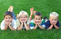 Children in Grass Image