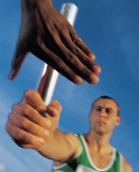 runners hand off baton